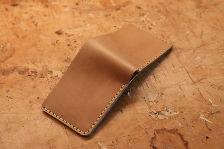 Hand-stitched Bulwark bifold in Horween Unglazed Natural Shell Cordovan, closed